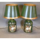 A Pair Of Tole Ware Table Lamps in the form of armorial canisters highlighted with gilt upon a green