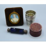 A Blue Glass Double Ended Scent Bottle together with an oval portrait miniature and a stirrup cup