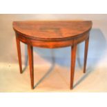 A 19th Century Mahogany Demi Lune Tea Table, the hinged top above a plain frieze raised upon