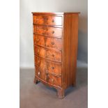 A Mahogany Bow Fronted Tall Chest Of Drawers, the moulded top above six drawers with circular