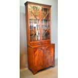 A 19th Century Mahogany Bookcase, the moulded cornice above two astragal glazed doors and two