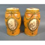 A Pair Of Tole Ware Small Covered Canisters each with gilded decoration on a mustard ground 18 cms