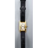 A Cartier Tank Americaine 18ct. Gold Cased Wrist Watch with original leather strap and buckle marked