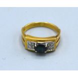An 18ct Gold Sapphire And Diamond Ring with a single oval sapphire flanked by diamonds 3 gms ring