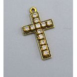 A Yellow Metal Crucifix Pendant set with twelve diamonds and black enamel, 2.5 x 1.5 cms, 2.7 gms.