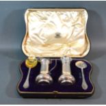 An Edwardian Silver Sugar Caster And Creamer Set with two matching spoons within a fitted case,