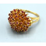 A 14ct Gold Dress Ring set with tiered rubies 10 gms, ring size S