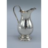 A Chester Silver Small Cream Jug with shaped handle and circular foot 3 ozs.