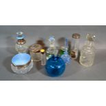 A Silver And Blue Enamel Scent Bottle together with a collection of other scent bottles and dressing