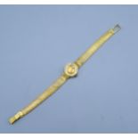 An Omega 18ct Gold Cased Ladies' Wrist Watch with 18ct gold strap 24.3 gms excluding movement
