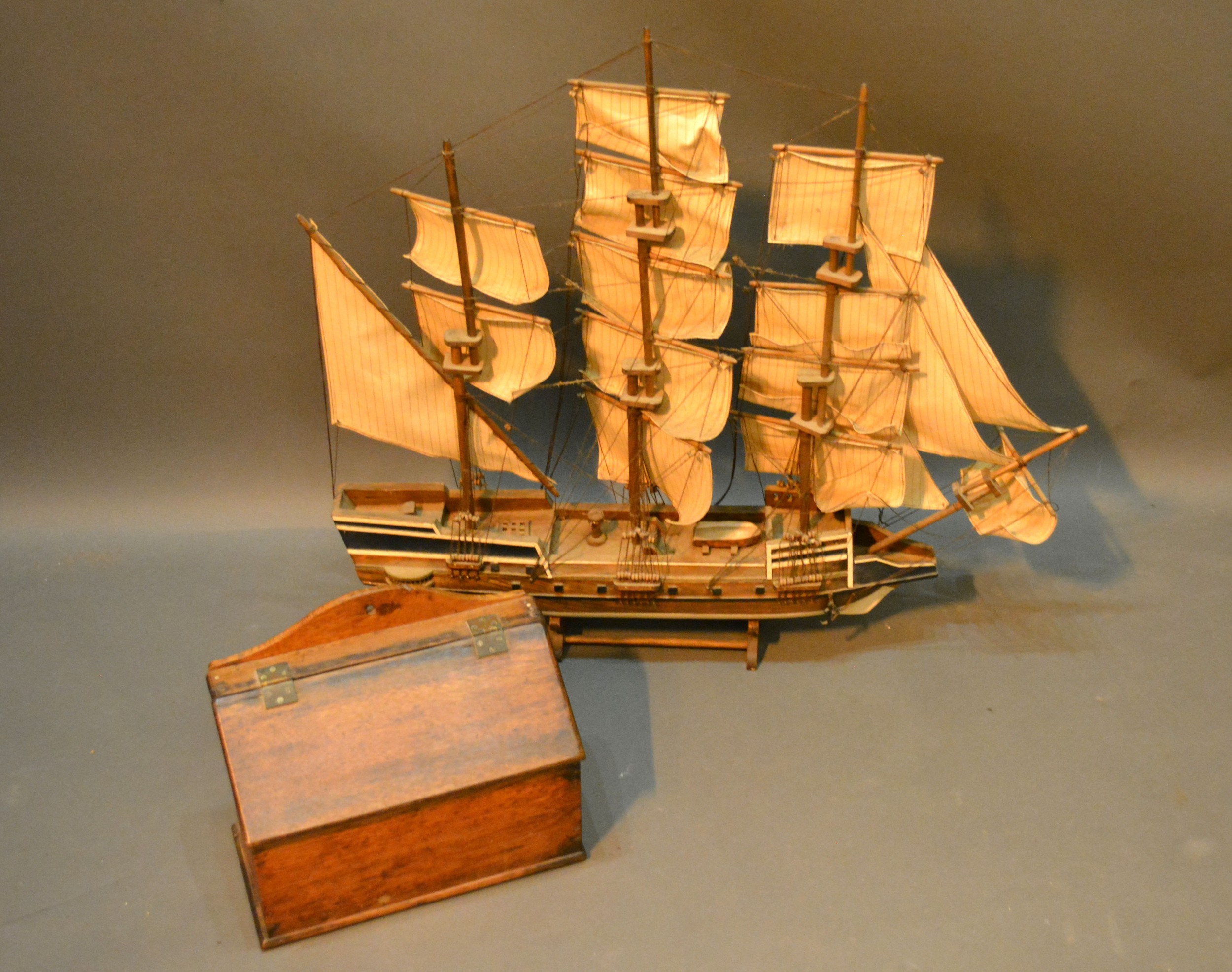 A Model Of A Three Masted Ship together with an oak candle box