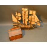 A Model Of A Three Masted Ship together with an oak candle box