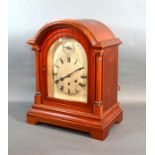 A Mahogany Mantle Clock By Gustav Becker, the dome top case with arched glazed door flanked by