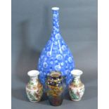 A Devon Fieldings Lustre Vase decorated with butterflies 9 cms tall together with a pair of