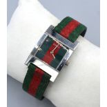 A Gucci Stainless Steel Cased Ladies Wrist Watch with canvas strap numbered 7700L and 0043994