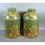 A Pair Of Tole Ware Large Covered Canisters each with gilded decoration upon a green ground 37.5 cms
