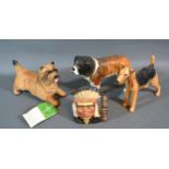 A Beswick Model Of A St. Bernard together with two other Beswick model dogs and a North American