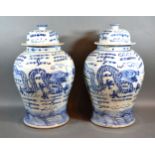 A Pair Of Chinese Underglaze Blue Decorated Covered Vases 45 cms tall