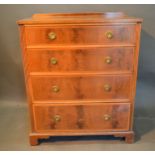 An Edwardian Mahogany Satinwood Crossbanded Chest of four long drawers with circular brass handles