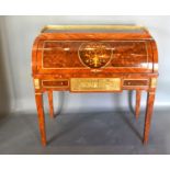 A French style marquetry inlaid and gilt metal mounted bureau, the low brass gallery above a cube
