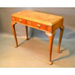 A Circa 1920's Queen Anne Style Walnut Side Table, the leather inset top above two frieze drawers