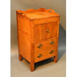 A 19th Century Mahogany Nightstand, the low shaped galleried top above two doors and pullout