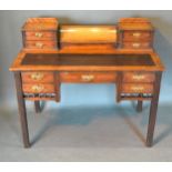 A Victorian Mahogany Writing Desk, the superstructure with drawers and stationery compartments above