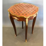 A French inlaid and gilt metal mounted lamp table, the star inlaid shaped top above a shaped