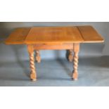A Circa 1930's Oak Draw Leaf Dining Table with barley twist legs 151 x 91 cms fully extended