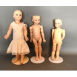 A 1987 Copy Of An Albert Marque bisque head Doll with Seeley body together with another similar