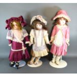 An SCS 1985 Bisque Headed Doll with Seeley body together with two other SCS Bisque headed dolls