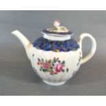 An 18th Century English Porcelain Teapot Of Melon Form, the cover with foliate surmount decorated