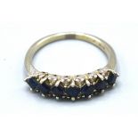 An 18ct. White Gold Sapphire And Diamond Band Ring 3.5 gms. ring size O