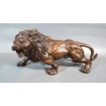 A Patinated Bronze Model In The Form Of A Lion 30 cms long