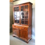 A 19th Century Mahogany Bookcase, the moulded cornice above two astragal glazed doors enclosing
