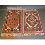 A North West Persian Woollen Small Rug with an all over design upon a red blue and cream ground