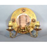 An Embossed Brass Mirrored Wall Sconce with copper foliate decoration 23 cms diameter