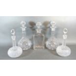 Two Pairs Of Cut Glass Decanters together with another similar of rectangular form