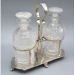 A George V Silver Stand containing two cut glass decanter, Sheffield 1925, 22 ozs. 24 cms tall