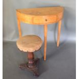 A Demi Lune Side Table with a frieze drawer raised upon square tapering legs together with a