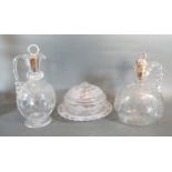 A 19th Century Glass Claret Jug Etched With Roses together with another similar claret jug and a