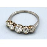 An 18ct. Five Stone Diamond Ring set with five graduated diamonds claw set 2.6 gms. ring size O