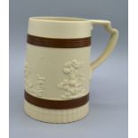 A Staffordshire Brown Glazed Stoneware Tankard by John Turner decorated in relief with classical
