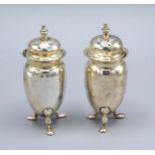 A Pair Of Sheffield Silver Peppers Of Oviform with three low feet 4 ozs.