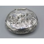 A Dutch White Metal Snuff Box decorated in relief with figures 8 x 9.5 cms