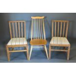 An Ercol Elm And Beech Stick Back Chair together with a pair of 19th Century side chairs