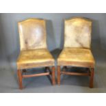 A Pair Of Leather And Brass Studded Side Chairs with square legs and stretchers