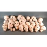 A SCS bisque Doll's Head dated 1995 S331 together with a collection of 24 bisque dolls' heads