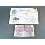 A Bank of England White Five Pound Note numbered K70004494 together with a 10 Shillings Note