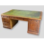 A Victorian Mahogany Large Twin Pedestal Partners Desk, the green tooled leather inset top above six